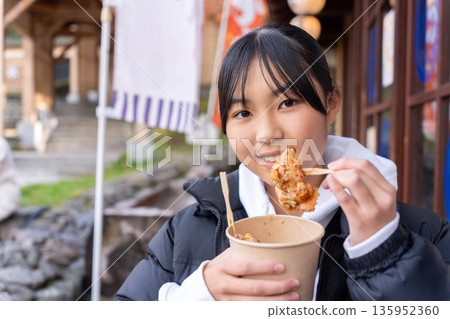 A teenage girl eating her way around Kusatsu Onsen on a trip 135952360