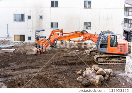 Power shovel working at a civil engineering construction site Power shovel working at a civil engineering construction site 135953335