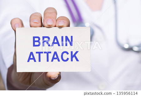 The healthcare professional is holding a BRAIN ATTACK card. 135956114