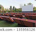 Outdoor cinema with white projection screen 135956126