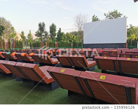 Outdoor cinema with white projection screen Outdoor cinema with white projection screen 135956126
