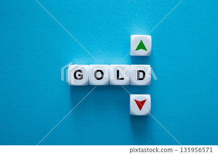 Gold price fluctuation concept showing up and down arrows 135956571