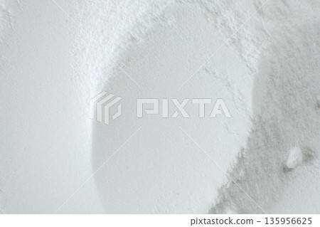 Soda powder sodium bicarbonate surface. Abstract white background. White texture with wavy patterns top view 135956625