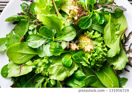 Detailed view of salad greens with lettuce leaves and leafy mix 135956729