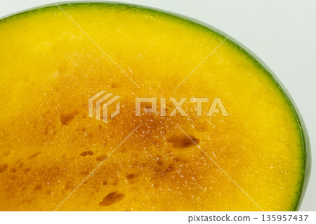 Macro Texture of Slice of Overripe Fresh Mango. Macro Texture of Slice of Overripe Fresh Mango. 135957437