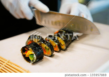 Korean Kimbap: The Culinary Process of Rolling and Slicing Gimbap 135957869
