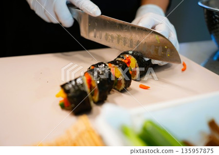Korean Kimbap: The Culinary Process of Rolling and Slicing Gimbap 135957875