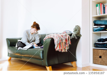 young woman writing notebook young woman writing notebook 135958187