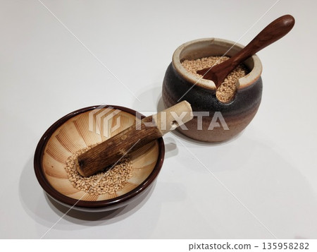 Sesame Seeds or Perilla Seeds in Traditional Ceramic Bowl and Mortar Sesame Seeds or Perilla Seeds in Traditional Ceramic Bowl and Mortar 135958282