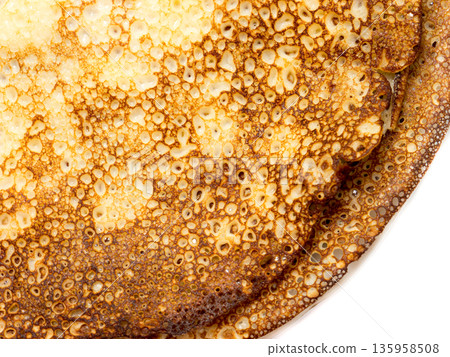 Pancakes lying on a plate. 135958508