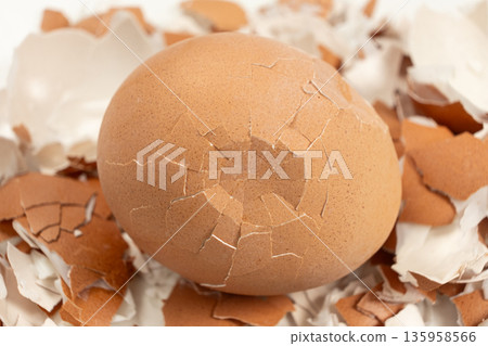Broken shell texture, macro shot of a hard boiled egg. Broken shell texture, macro shot of a hard boiled egg. 135958566