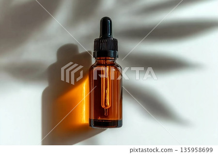 cosmetic makeup bottle serum dropper product with skin care concept on light background in leaf shadows. cosmetic makeup bottle serum dropper product with skin care concept on light background in leaf shadows. 135958699