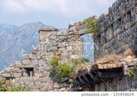 A historic stone fortress along a rugged mountain ridge A historic stone fortress along a rugged mountain ridge 135959024