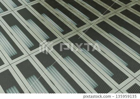 Industrial metal grid floor with illuminated rectangular patterns 135959135