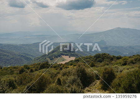 Explore nature in the mountains of Georgia with clouds and green hills in summer Explore nature in the mountains of Georgia with clouds and green hills in summer 135959276