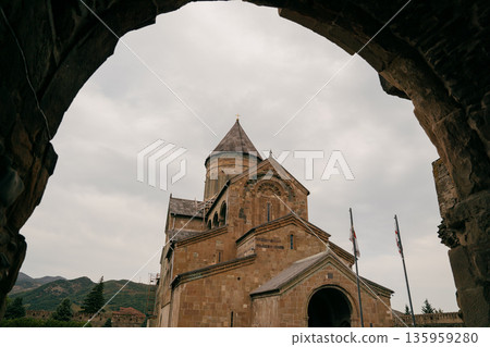 Visit to Svetitskhoveli Cathedral in Mtskheta, Georgia during overcast weather Visit to Svetitskhoveli Cathedral in Mtskheta, Georgia during overcast weather 135959280