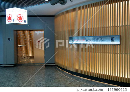 Frankfurt, Germany, 03 November 2017: Entrance to a frequent flyer lounge with bright wooden interior Frankfurt, Germany, 03 November 2017: Entrance to a frequent flyer lounge with bright wooden interior 135960613