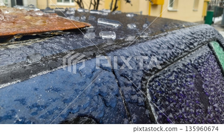 Rusty metal board atop icy vehicle roof with crystalline frost grains captures winter texture, cold accumulation, ice sheen and corroded metallic surface. Rusty metal board atop icy vehicle roof with crystalline frost grains captures winter texture, cold accumulation, ice sheen and corroded metallic surface. 135960674