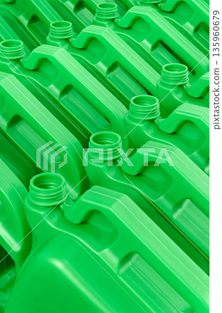 Empty green plastic canisters for technical fluids - motor oil, antifreeze, etc. 135960679