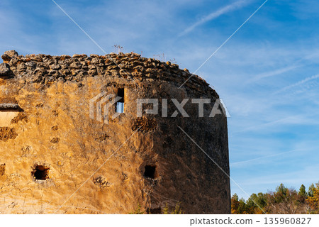 Ancient stone tower at Monasterio de Piedra against a bright blue sky Ancient stone tower at Monasterio de Piedra against a bright blue sky 135960827