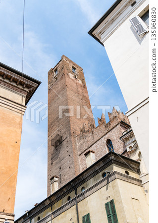 The historic Torre della Gabbia in Mantua, Italy, against a blue sky. 135960830