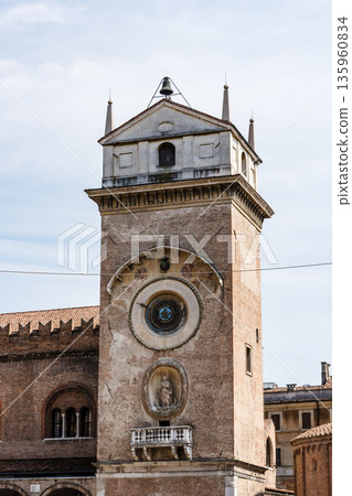 The iconic Clock Tower in Mantua, Italy, against a bright sky. 135960834