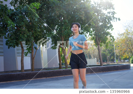 woman running in the park woman running in the park 135960966