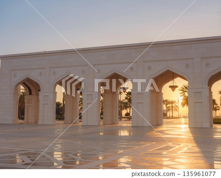 Elegant exterior showcases traditional Arabic design elements with ornate arches and decorative lanterns. White marble walls and geometric patterns create authentic oriental atmosphere Elegant exterior showcases traditional Arabic design elements with ornate arches and decorative lanterns. White marble walls and geometric patterns create authentic oriental atmosphere 135961077