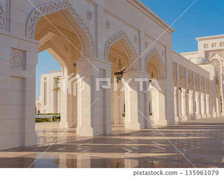 Elegant exterior showcases traditional Arabic design elements with ornate arches and decorative lanterns. White marble walls and geometric patterns create authentic oriental atmosphere 135961079