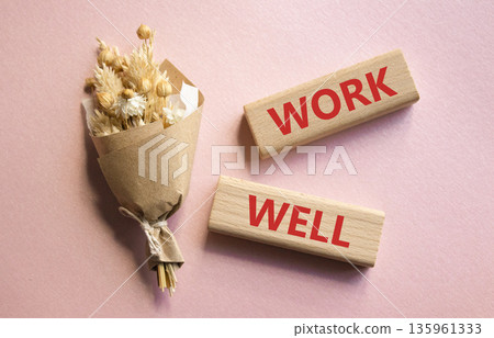 Work Well symbol. Wooden blocks with words Work Well. Beautiful pink background. Business and Work Well concept. Copy space. 135961333