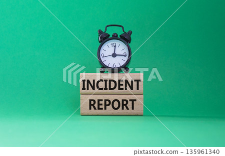 Incident Report symbol. Concept word Incident Report on wooden blocks. Beautiful green background. Business and Incident Report concept. Copy space 135961340