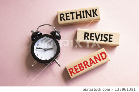 Rethink Revise Rebrand symbol. Wooden blocks with words Rethink Revise Rebrand. Beautiful pink background with alarm clock. Business and Rethink Revise Rebrand concept. Copy space. Rethink Revise Rebrand symbol. Wooden blocks with words Rethink Revise Rebrand. Beautiful pink background with alarm clock. Business and Rethink Revise Rebrand concept. Copy space. 135961381