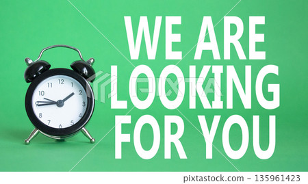 Tell us what you think symbol. Wooden blocks with words Tell us what you think. Beautiful green background with alarm clock. Business and Tell us what you think concept. Copy space. 135961423