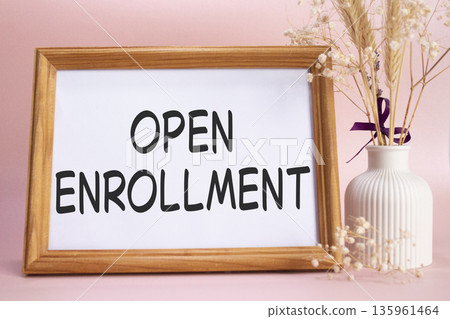 Open Enrollment symbol. Concept words Open Enrollment on beautiful wooden picture frame. Beautiful pink background with flower vase. Business and Open Enrollment concept. Copy space. Open Enrollment symbol. Concept words Open Enrollment on beautiful wooden picture frame. Beautiful pink background with flower vase. Business and Open Enrollment concept. Copy space. 135961464