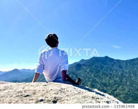 Man reaches the summit 135961498