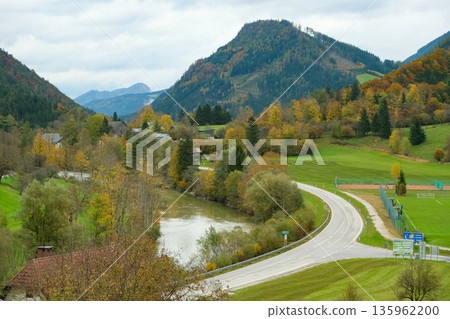 Empty Asphalt Road Winding Through Colorful Fall Nature Scene Empty Asphalt Road Winding Through Colorful Fall Nature Scene 135962200
