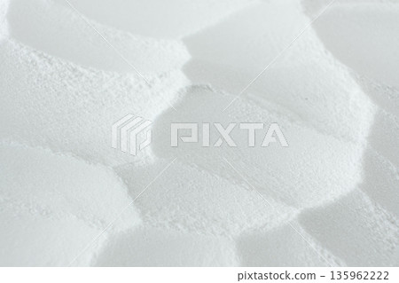 Soda powder sodium bicarbonate surface. Abstract white background. White texture with wavy patterns top view 135962222
