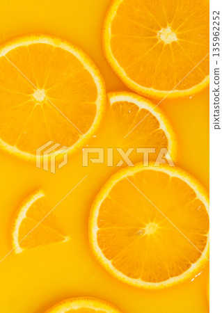 Vertical macro of orange slices in fresh juice, mobile wallpaper. Vertical macro of orange slices in fresh juice, mobile wallpaper. 135962252