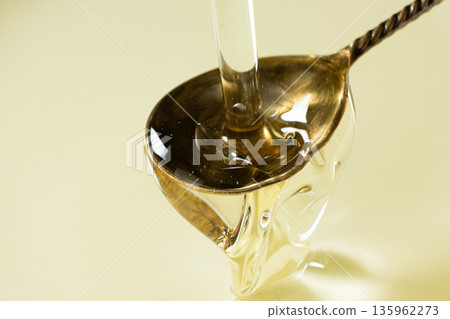 Refined Vegetable Oil Pouring, Spoon Close-Up. 135962273