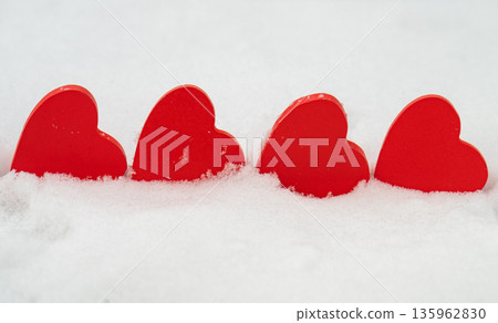 red hearts on the snow= 135962830