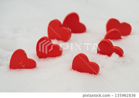 red hearts on the snow= 135962836