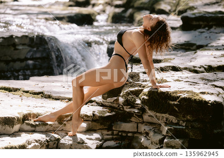 Gorgeous woman in bikini enjoying on sunny river Gorgeous woman in bikini enjoying on sunny river 135962945