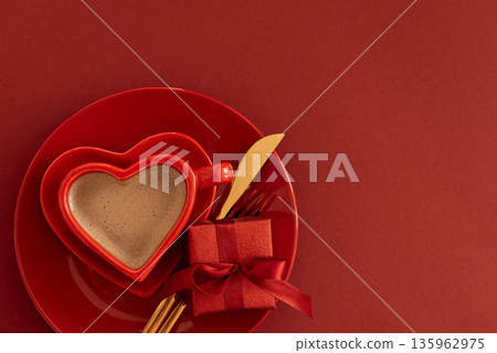 Heart Shaped Coffee Cup with Gift Box. Romantic Valentines Day Table Setting on Red Background 135962975