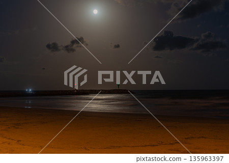 Night Beach with Full Moon and Gentle Waves Night Beach with Full Moon and Gentle Waves 135963397