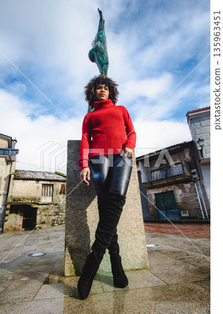 Woman in town square Woman in town square 135963451