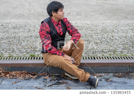 Man sitting in profile Man sitting in profile 135963455