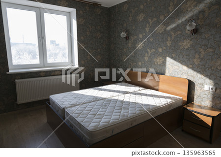 Bed in the bedroom with mattresses in the room Bed in the bedroom with mattresses in the room 135963565