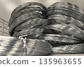 Spiral of shiny metal wire coils ready for crafting and construction projects 135963655