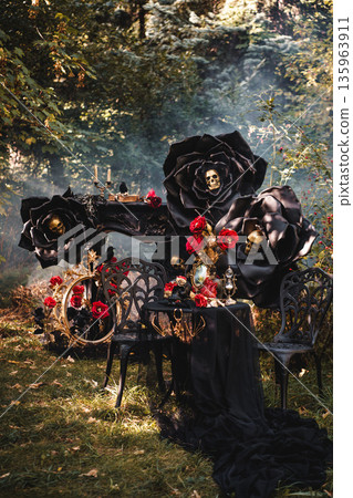 Dark Romantic Still Life with Black Roses and Antique Mirror 135963911