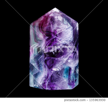 Polished Rainbow Fluorite Crystal Point on Black Background 135963930